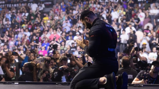 AngryBird kneels in prayer after winning Evo 2023